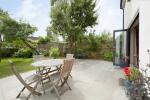 Three part bi fold door opening to the right and leading onto the patio